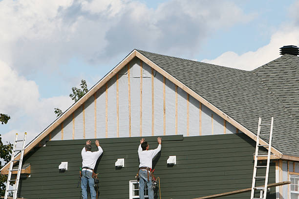 Professional Storm Damage Siding Repair technician working in Crabtree, PA